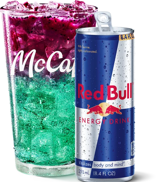 A McCafé cup of Red Bull Dragonberry Energizer next to a can of Red Bull